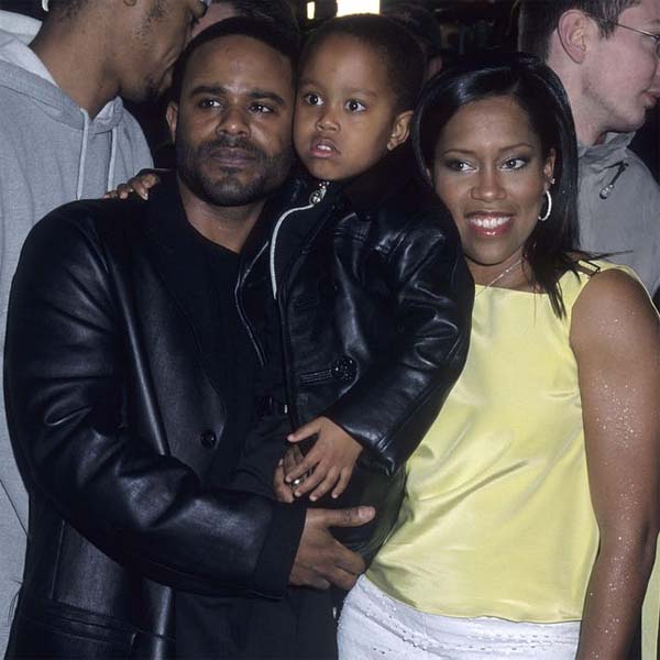 Ian taking a family photo with his ex-wife and son.